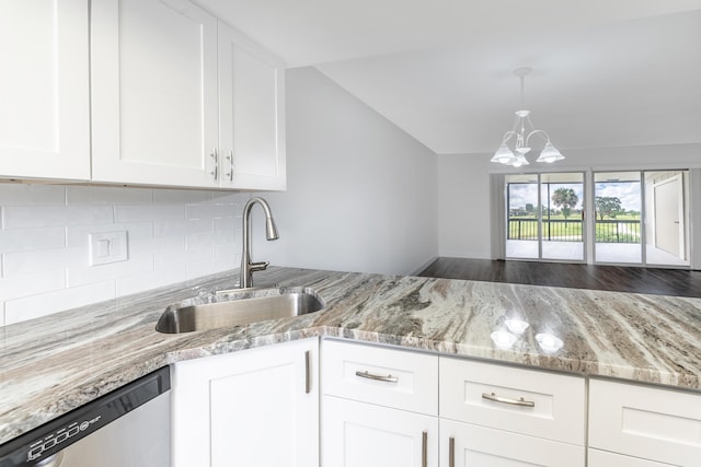 18520 SE Wood Haven Ln Unit I, Jupiter, FL 33469 - kitchen with a sink, dishwasher, decorative backsplash, light stone counters, and a chandelier