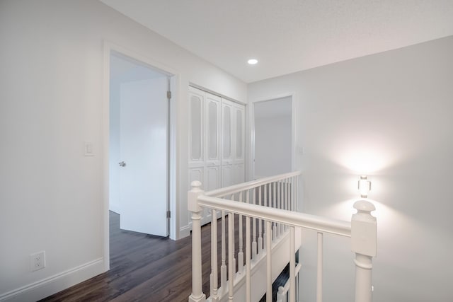 18520 SE Wood Haven Ln Unit I, Jupiter, FL 33469 - hallway featuring an upstairs landing, dark wood finished floors, recessed lighting, and baseboards