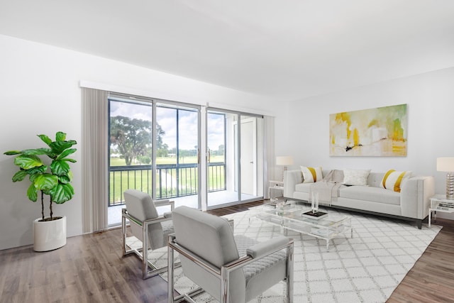 18520 SE Wood Haven Ln Unit I, Jupiter, FL 33469 - living room featuring wood finished floors and a water view