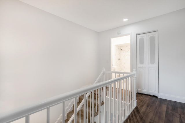 18520 SE Wood Haven Ln Unit I, Jupiter, FL 33469 - corridor with dark wood-style floors, recessed lighting, baseboards, and an upstairs landing