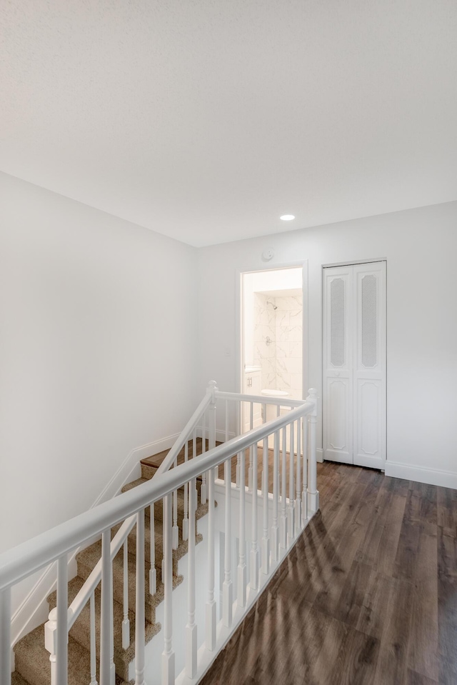 18520 SE Wood Haven Ln Unit I, Jupiter, FL 33469 - hallway with dark wood finished floors, baseboards, an upstairs landing, and recessed lighting