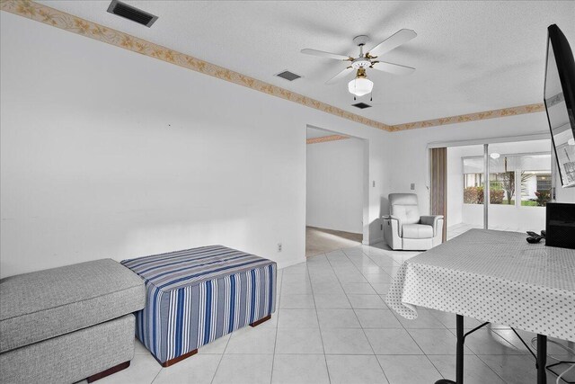 bedroom with ensuite bath and light carpet