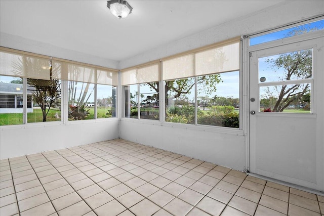 unfurnished sunroom with a healthy amount of sunlight