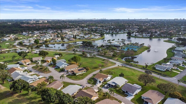 bird's eye view featuring a water view and a residential view