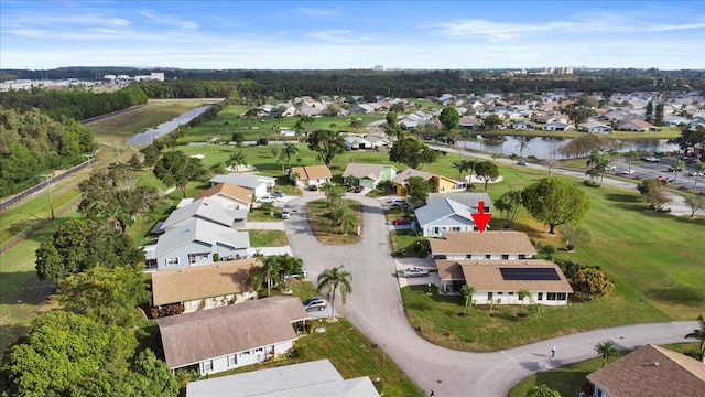 birds eye view of property featuring a water view and a residential view