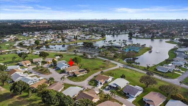 bird's eye view featuring a residential view and a water view