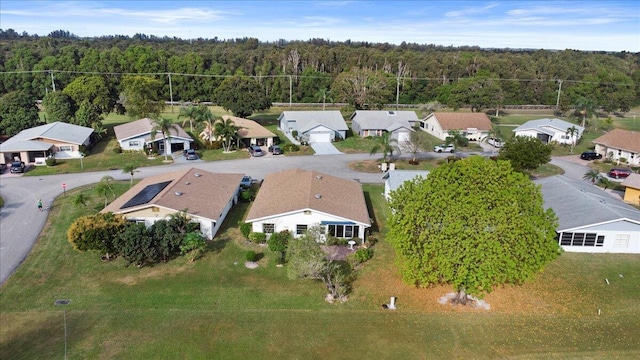 birds eye view of property with a residential view and a wooded view