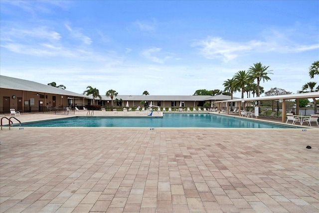 community pool featuring a patio area