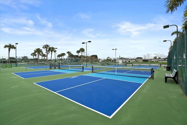 view of tennis court with fence