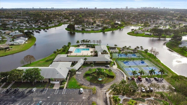 birds eye view of property with a residential view and a water view