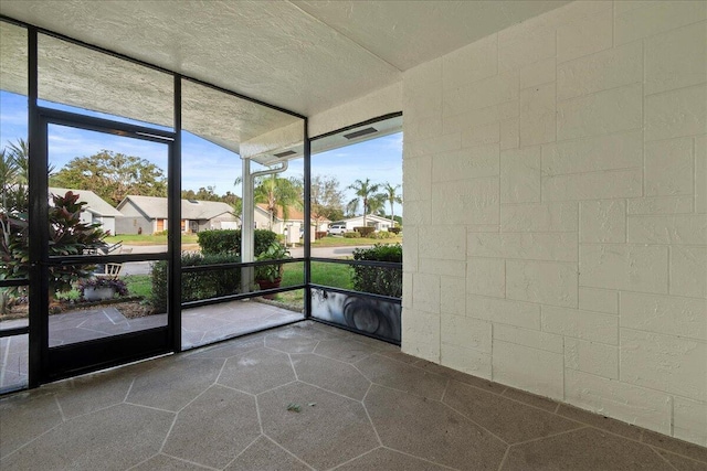 unfurnished sunroom with a residential view