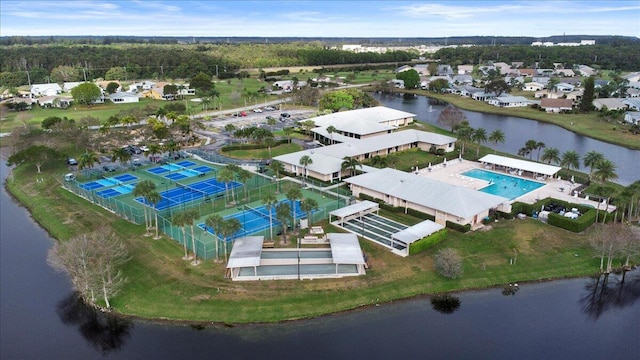 birds eye view of property with a water view and a residential view