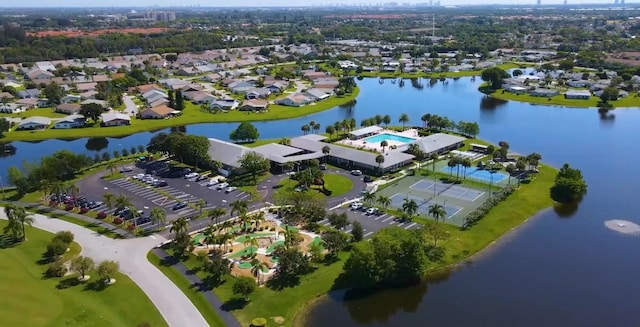 birds eye view of property featuring a water view and a residential view