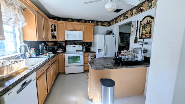 kitchen featuring white appliances, ceiling fan, decorative backsplash, a textured ceiling, and sink