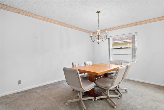 carpeted dining space featuring a chandelier, a textured ceiling, and baseboards