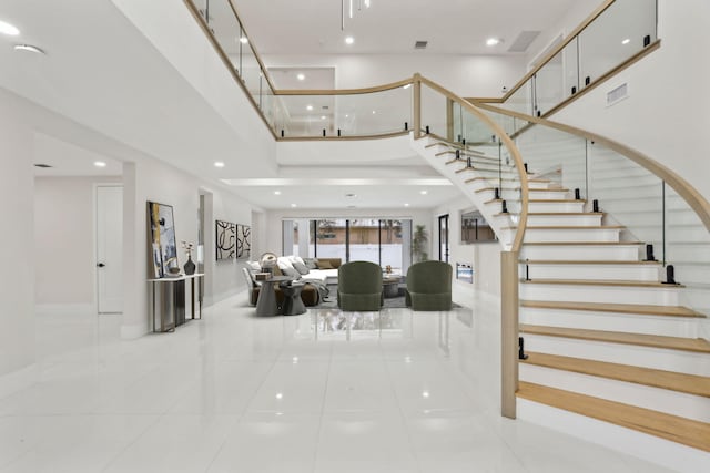 staircase featuring tile patterned flooring