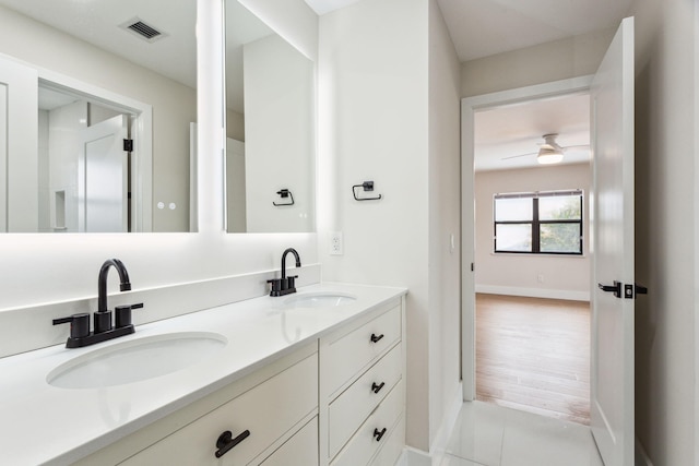 bathroom with ceiling fan, vanity, and tile patterned floors