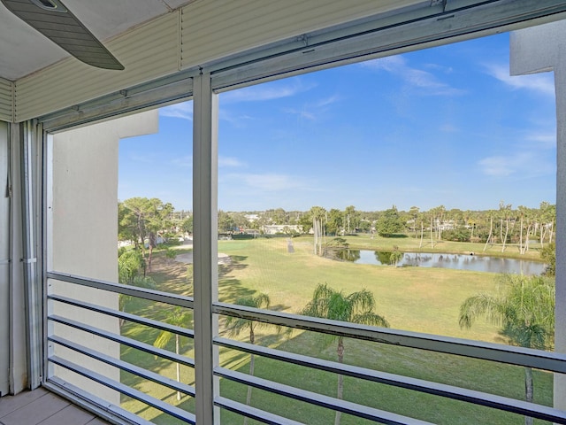 unfurnished sunroom featuring a water view