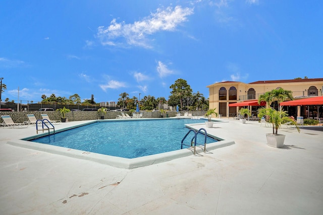 view of swimming pool featuring a patio