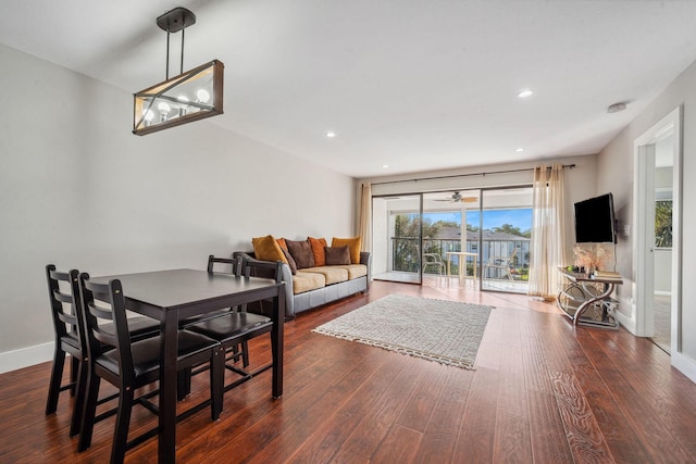 dining room with dark hardwood / wood-style flooring