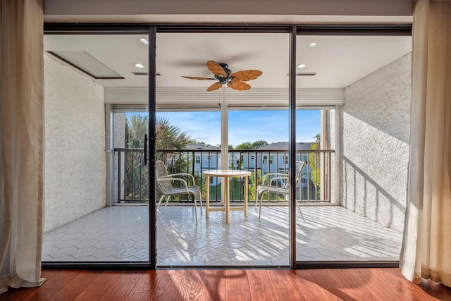 entryway featuring ceiling fan and wood-type flooring