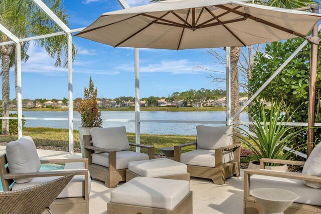 view of swimming pool with a water view, grilling area, a patio, and glass enclosure