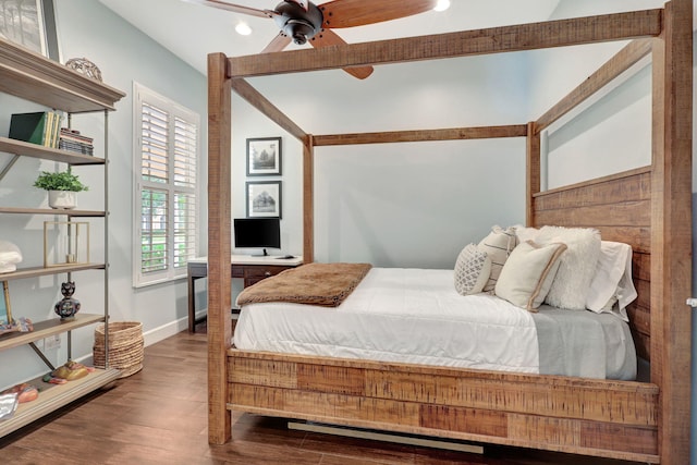 bedroom featuring ceiling fan, vaulted ceiling, and hardwood / wood-style flooring