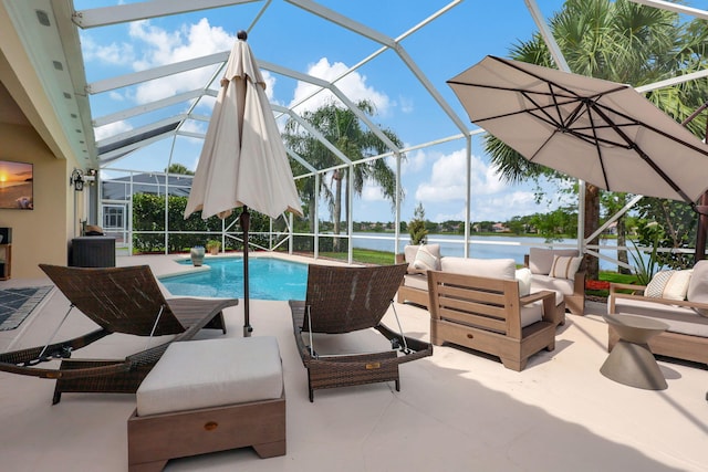 view of pool featuring outdoor lounge area, glass enclosure, and a patio