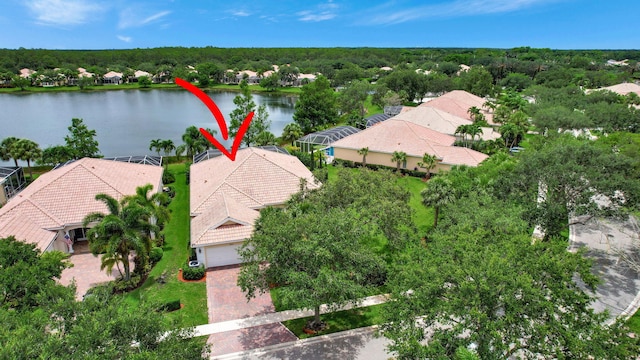 birds eye view of property with a water view