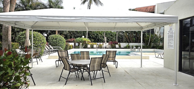 view of patio with a gazebo and a community pool