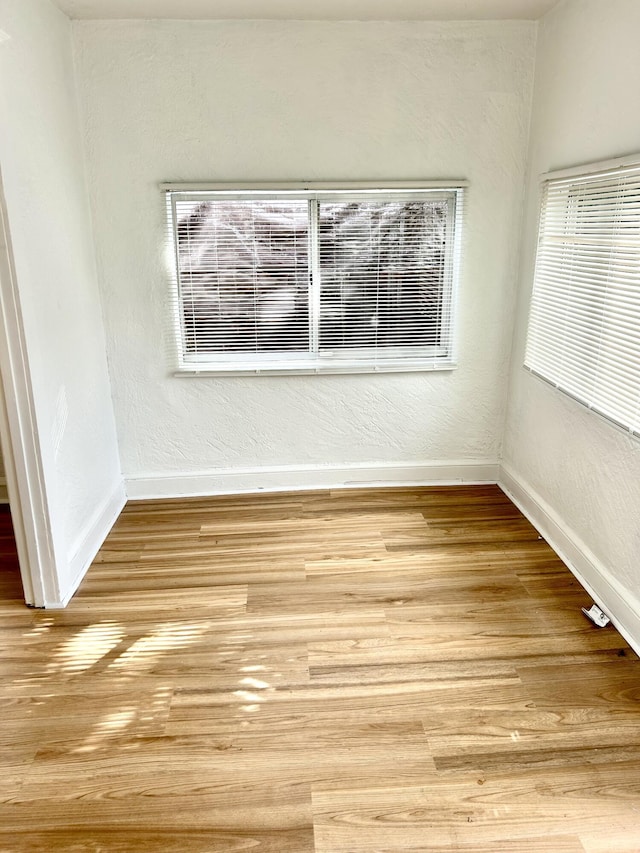 unfurnished room featuring light wood-type flooring