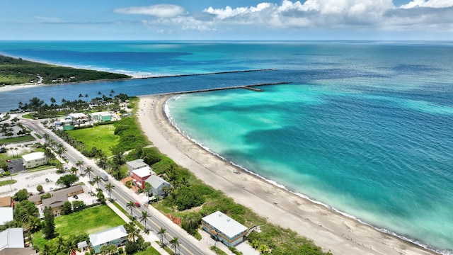 drone / aerial view with a view of the beach and a water view