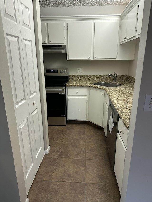 kitchen with white cabinets, sink, light stone countertops, and stainless steel electric range