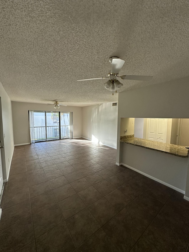 unfurnished room featuring ceiling fan