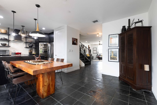 dining room featuring ceiling fan