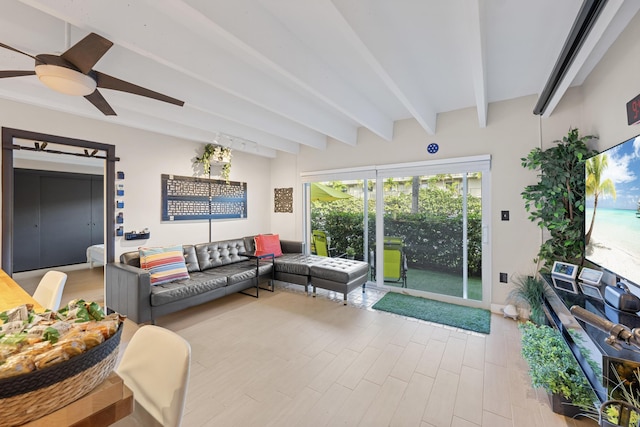 living room featuring ceiling fan and beamed ceiling