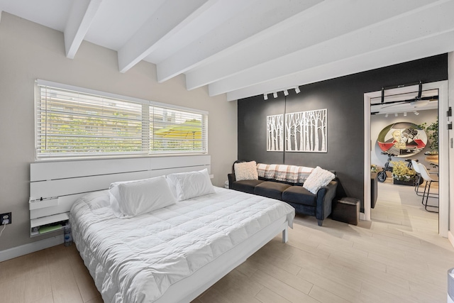 bedroom featuring beamed ceiling