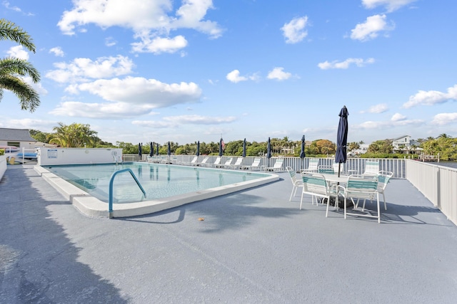 view of swimming pool featuring a patio