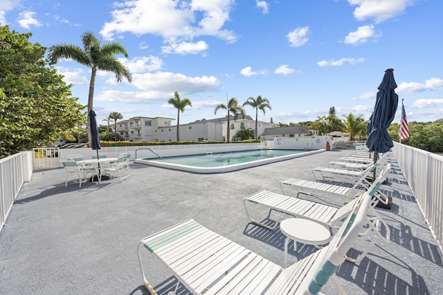 view of swimming pool featuring a patio area