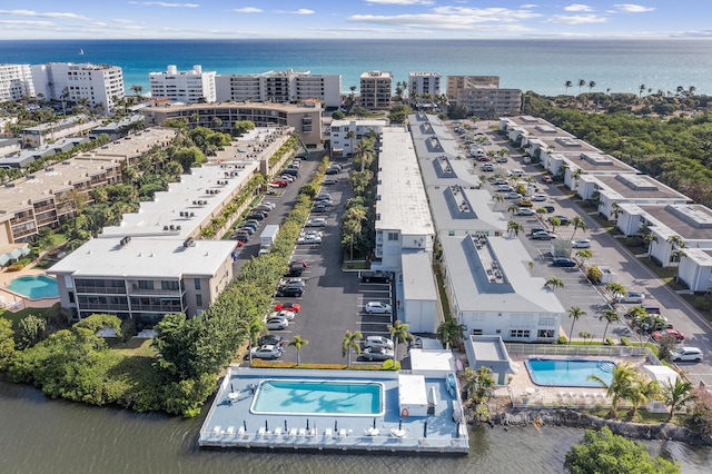 birds eye view of property featuring a water view