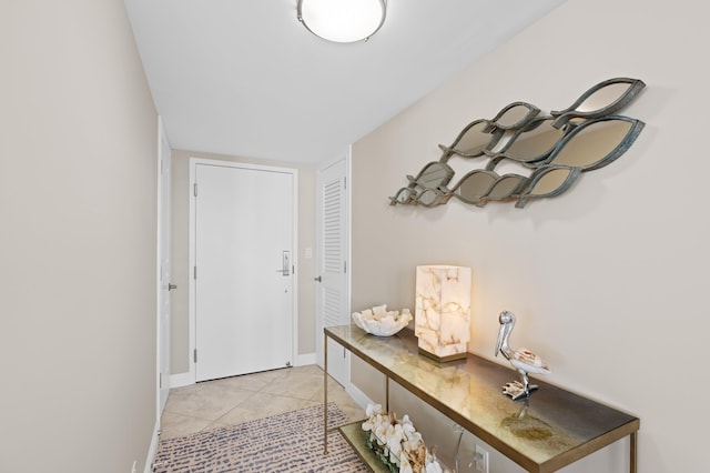 entryway with light tile patterned floors