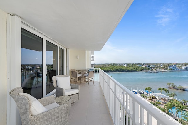 balcony featuring a water view