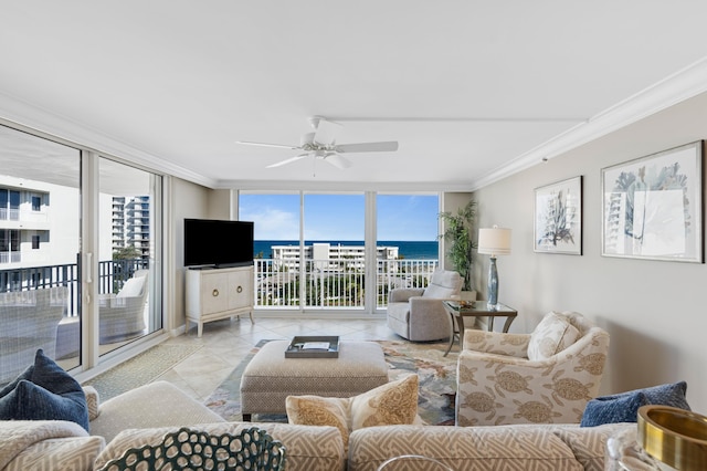 tiled living room featuring ceiling fan, expansive windows, and ornamental molding