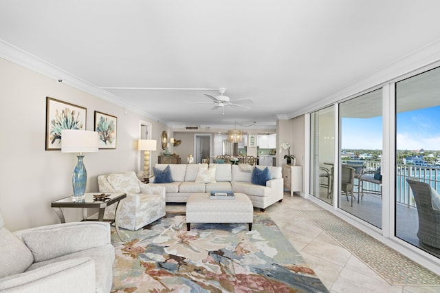 tiled living room with ceiling fan and ornamental molding