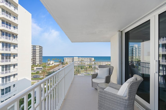 balcony featuring a water view