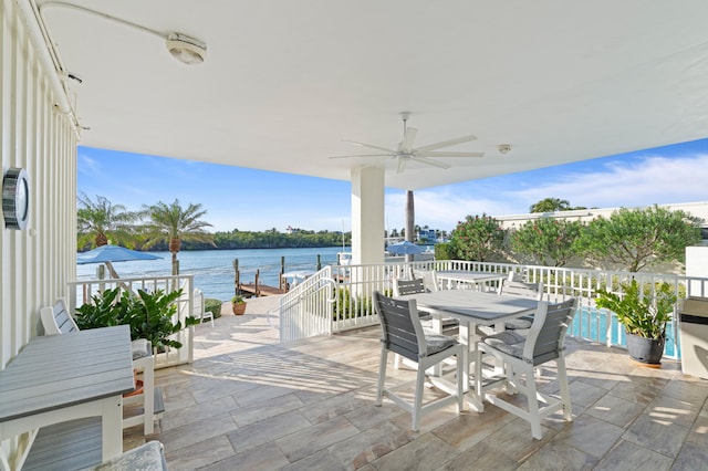 view of patio / terrace with ceiling fan and a water view