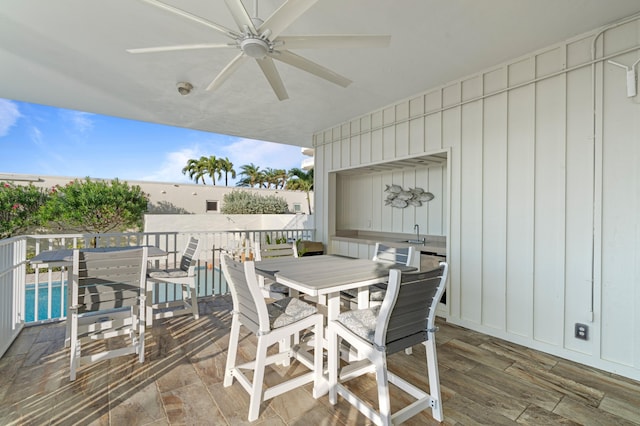 view of patio / terrace featuring ceiling fan and a deck