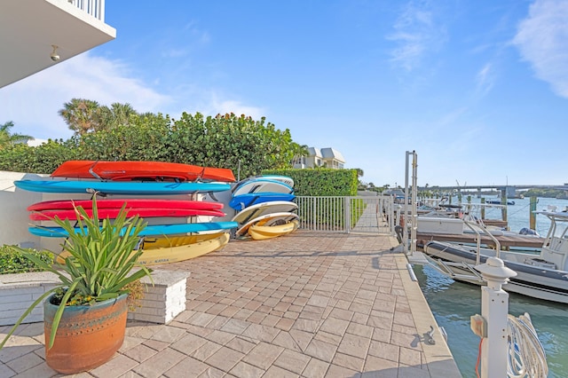 view of patio / terrace featuring a dock and a water view