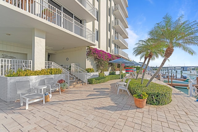 view of property's community featuring a patio area