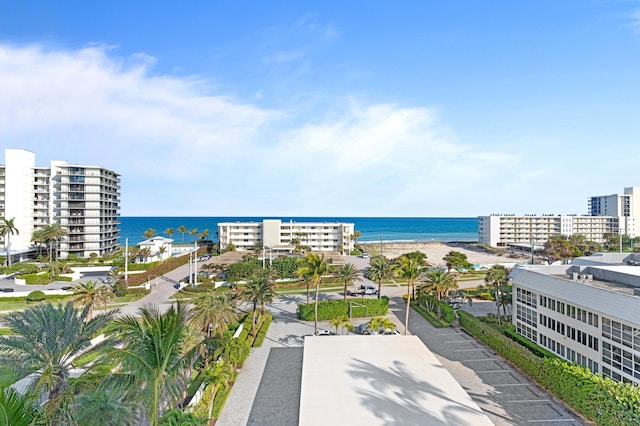 birds eye view of property featuring a water view and a view of the beach